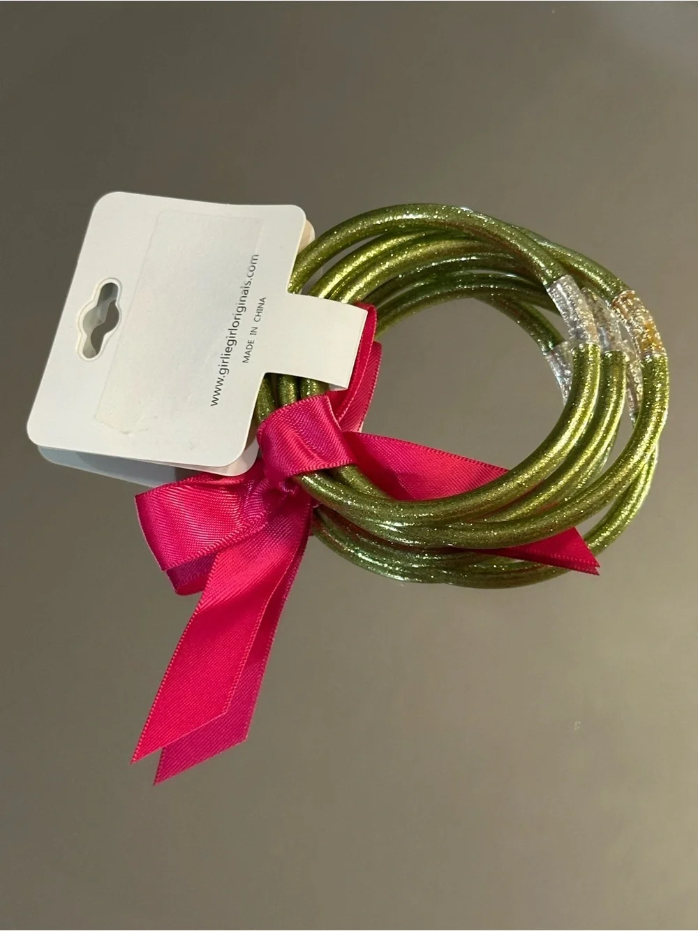Girlie Girl Originals. 3 Glittery Green Bracelets with Pink Ribbon. (NWT)